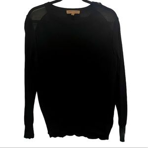 black sweater with sheer shoulder cutouts